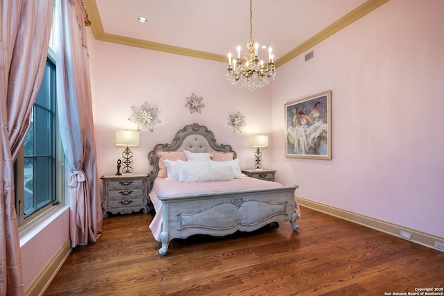 bedroom with crown molding, dark hardwood / wood-style floors, and a chandelier