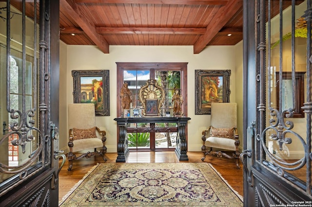 foyer featuring hardwood / wood-style floors, a wealth of natural light, and wood ceiling