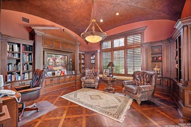 home office featuring lofted ceiling and ornate columns