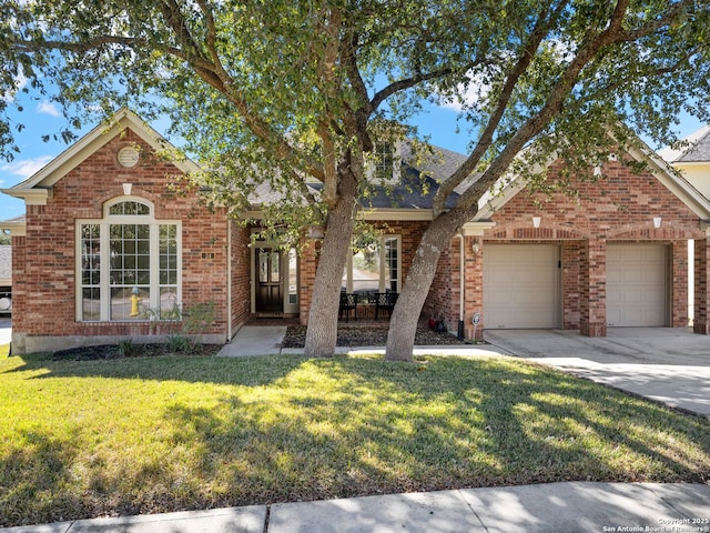 view of front facade with a garage and a front yard