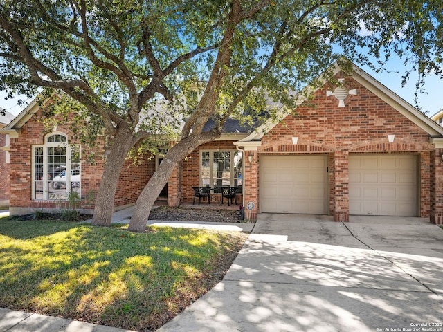 view of front property with a garage and a front yard