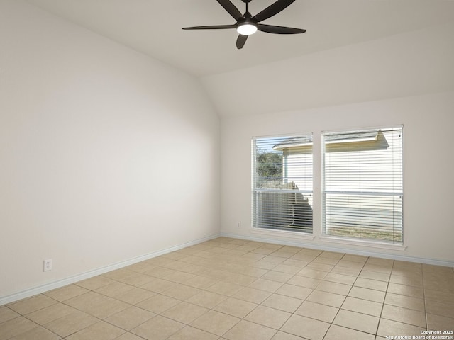 unfurnished room with ceiling fan and vaulted ceiling