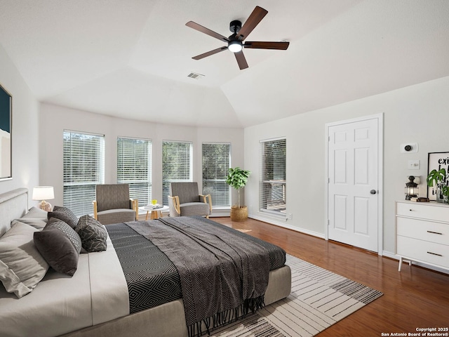 bedroom featuring lofted ceiling, dark hardwood / wood-style floors, and ceiling fan