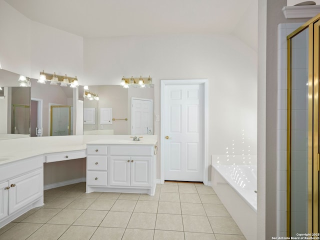 bathroom featuring tile patterned flooring, vanity, vaulted ceiling, and shower with separate bathtub