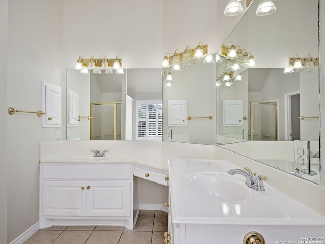 bathroom featuring vaulted ceiling, vanity, an enclosed shower, and tile patterned flooring