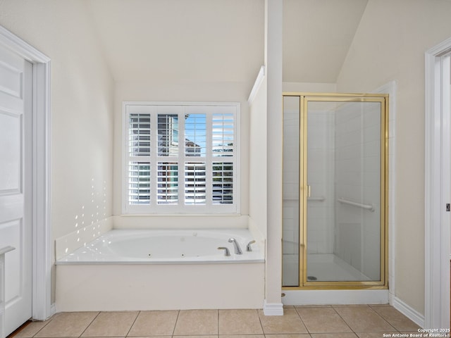 bathroom with tile patterned flooring, lofted ceiling, and plus walk in shower