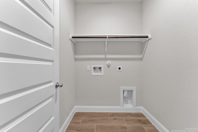 clothes washing area featuring gas dryer hookup, electric dryer hookup, and washer hookup