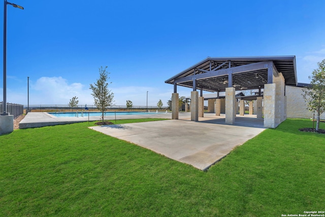 view of patio with a swimming pool