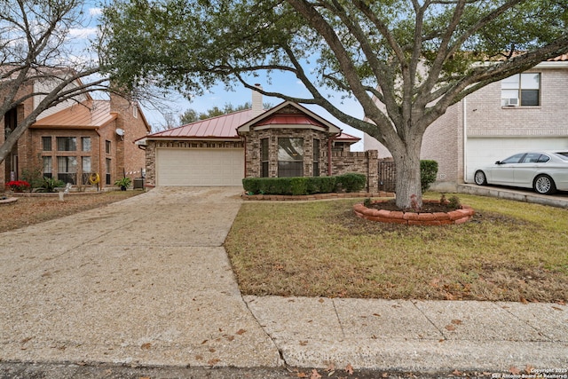 view of front of home with a garage and a front lawn