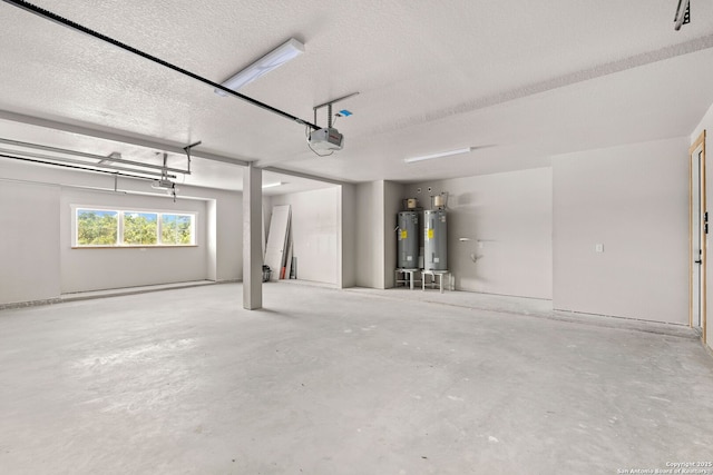 garage featuring a garage door opener and water heater