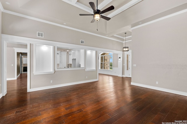 unfurnished living room with crown molding, dark wood-type flooring, and a high ceiling