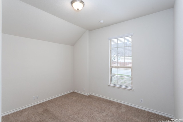 bonus room featuring vaulted ceiling and carpet flooring