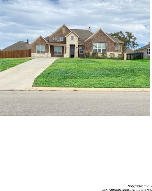 ranch-style house with a front lawn