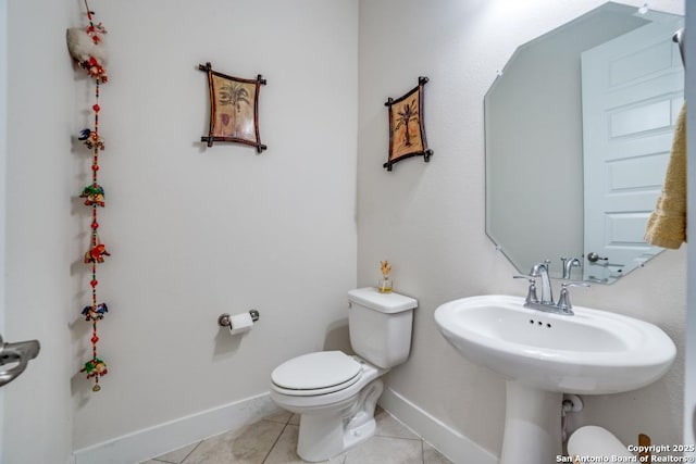 bathroom featuring tile patterned floors and toilet