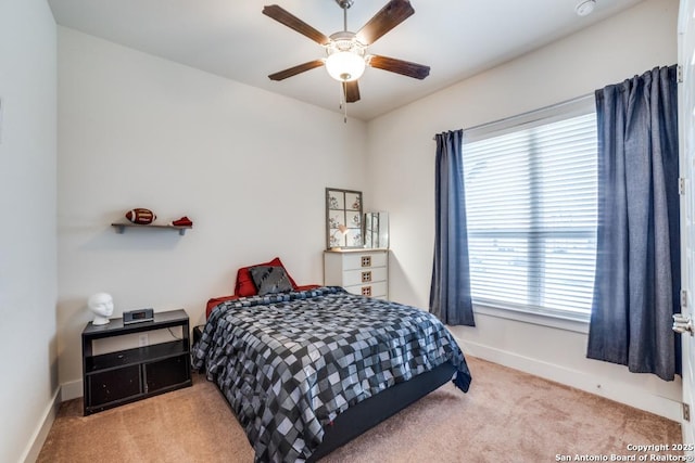 carpeted bedroom with ceiling fan