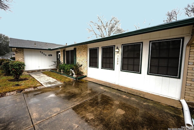 ranch-style home with a patio area