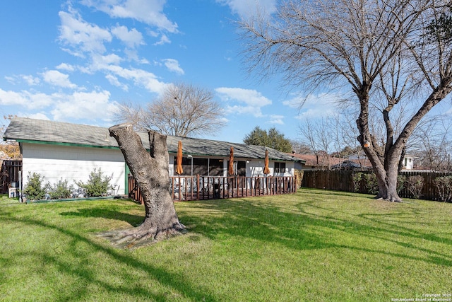 rear view of house featuring a lawn