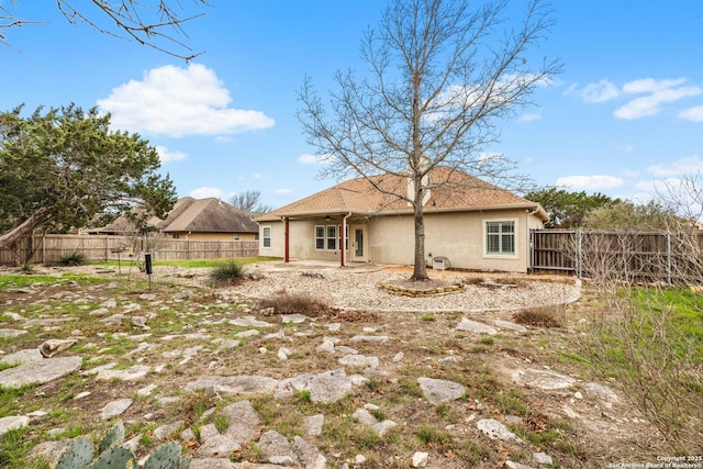 rear view of property with a patio area