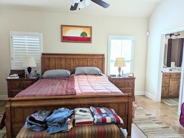 bedroom with ensuite bathroom and ceiling fan