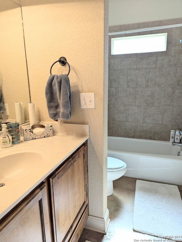 full bathroom featuring vanity, toilet, and tiled shower / bath combo