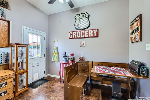 dining area with dark wood-type flooring and ceiling fan