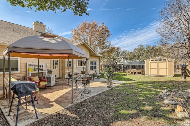 view of yard featuring a gazebo, a patio area, and a shed