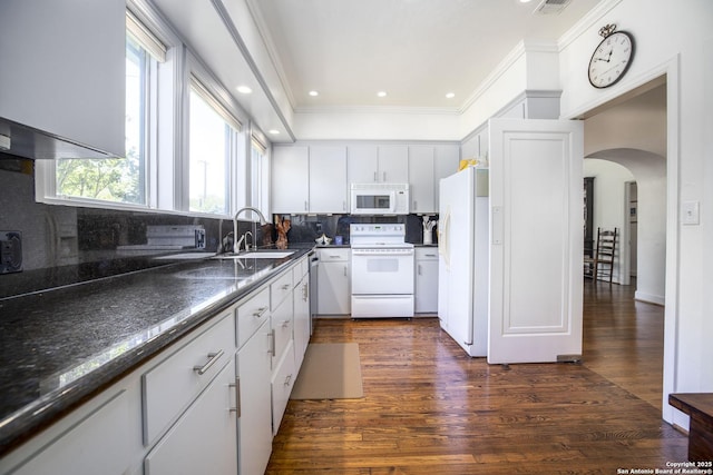 kitchen with sink, white cabinetry, ornamental molding, white appliances, and decorative backsplash