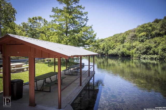 dock area featuring a gazebo and a water view