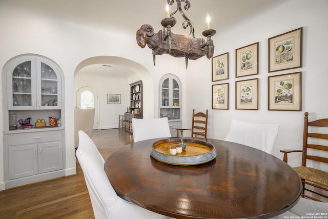 dining area featuring dark hardwood / wood-style flooring