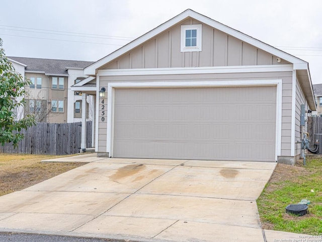 view of front of property featuring an outbuilding and a garage