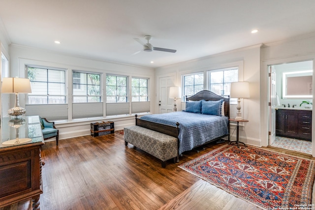 bedroom featuring dark wood-style floors, recessed lighting, crown molding, and baseboards