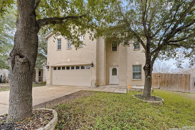 view of front facade with a garage and a front lawn