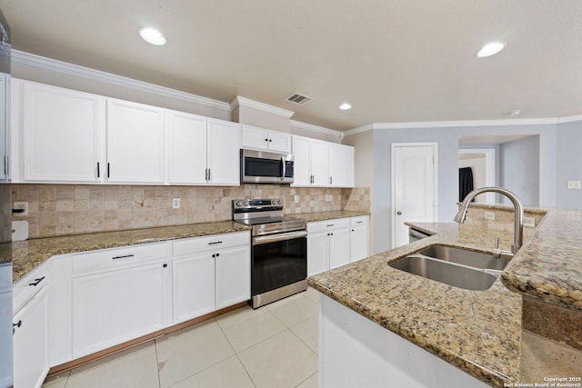 kitchen with sink, white cabinetry, crown molding, stone countertops, and stainless steel appliances