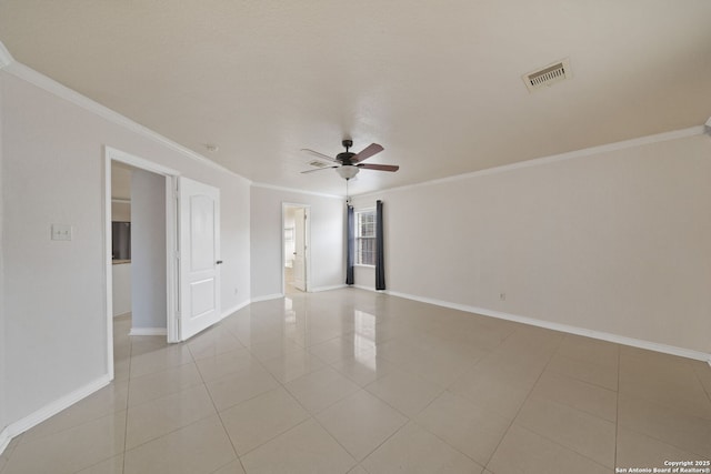 tiled spare room with crown molding and ceiling fan