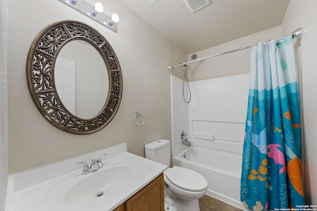 full bathroom featuring shower / tub combo with curtain, tile patterned flooring, vanity, toilet, and a textured ceiling