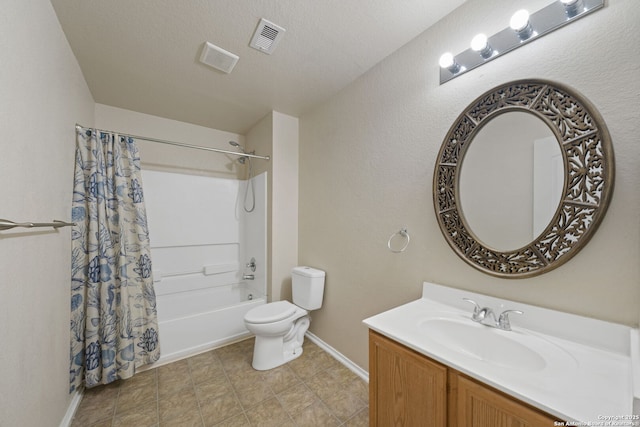 full bathroom with toilet, vanity, a textured ceiling, and shower / bath combo with shower curtain