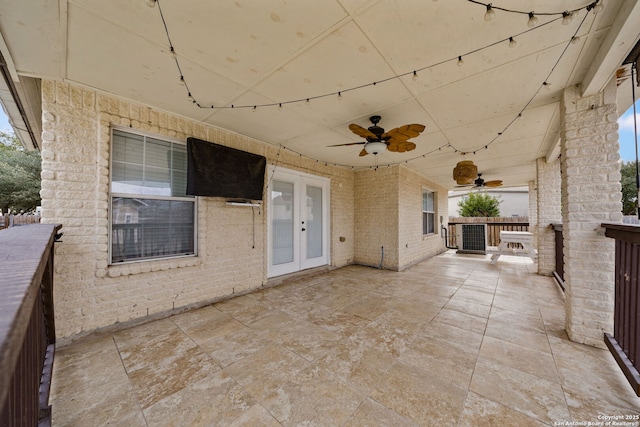 view of patio with french doors and ceiling fan