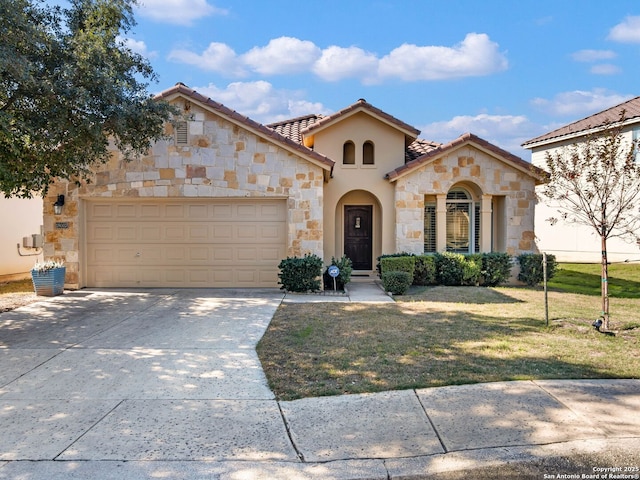 mediterranean / spanish-style house featuring a garage and a front lawn