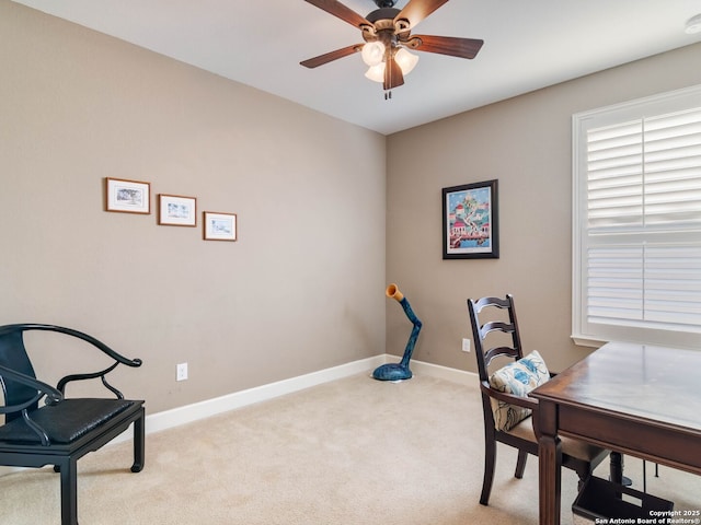 carpeted office with ceiling fan