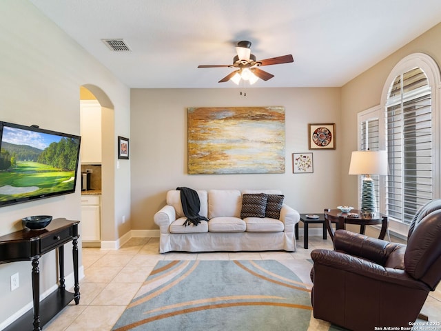 living room with ceiling fan and light tile patterned floors