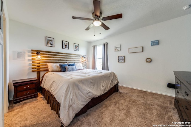 bedroom with ceiling fan and carpet