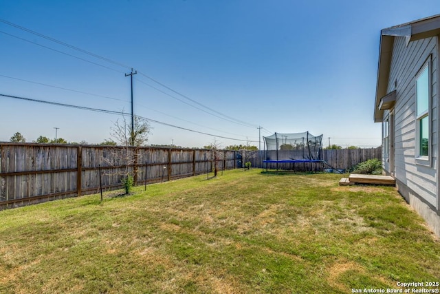 view of yard featuring a trampoline