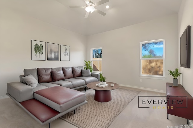 living room featuring light colored carpet and ceiling fan