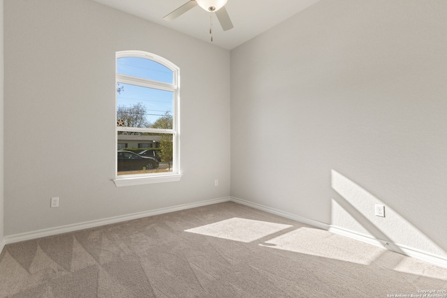 spare room with carpet and ceiling fan