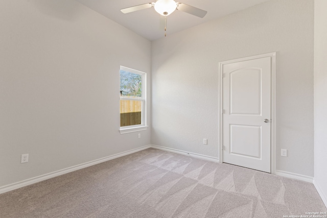 carpeted empty room with ceiling fan