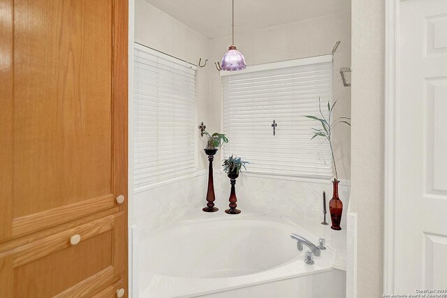 bathroom featuring a bath