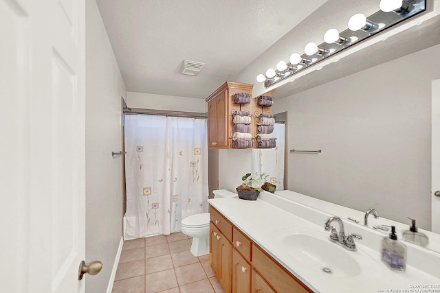 full bathroom with vanity, tile patterned floors, toilet, and shower / tub combo with curtain