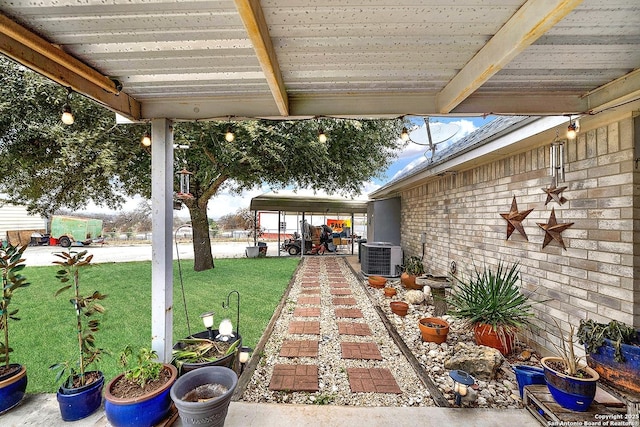 view of patio with a carport and central air condition unit