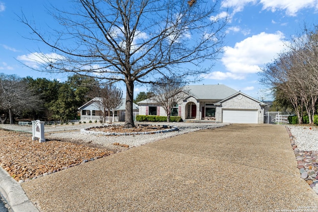 ranch-style home with driveway and a garage