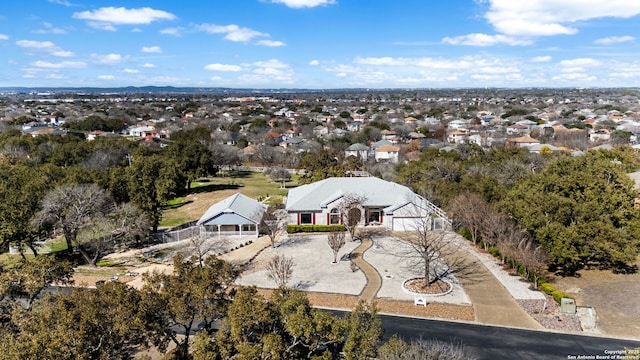 birds eye view of property with a residential view